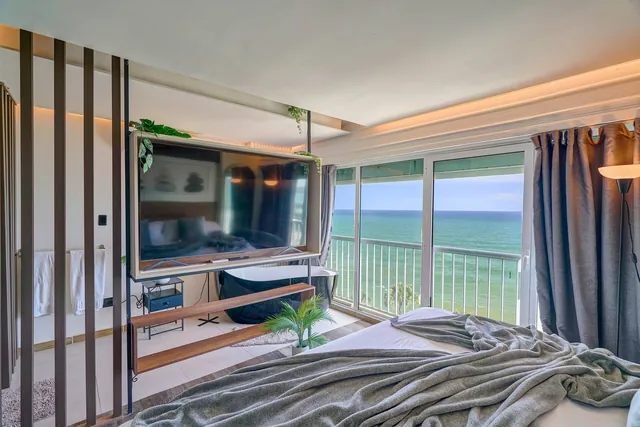 Penthouse room with a TV wall and sea windows