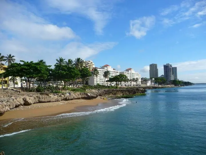 A small beach and rocky shoreline along the Santo Domingo seafront