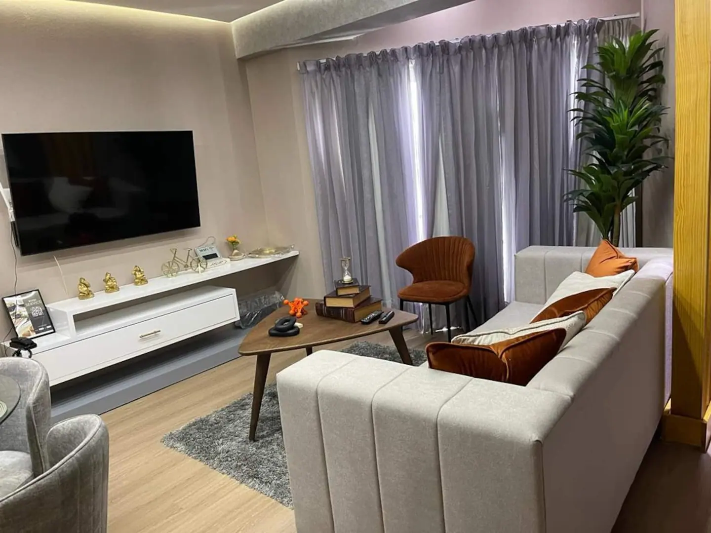 Living room of the river-view studio with a cream sofa